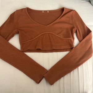 Long sleeve cropped top from garage. Size XS. Brown/Orange colour.